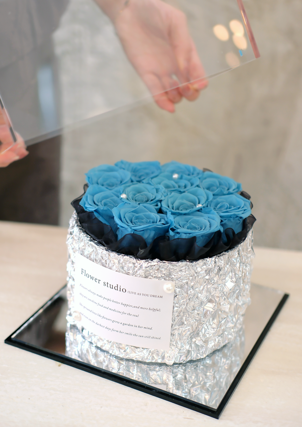 Blue preserved roses gift arrangement by EVERE Singapore